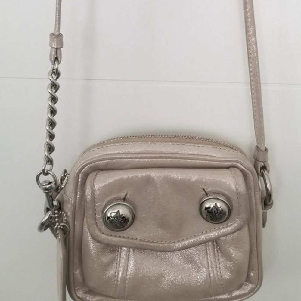 Coach Poppy mini crossbody bag in a metallic silver or pewter finish